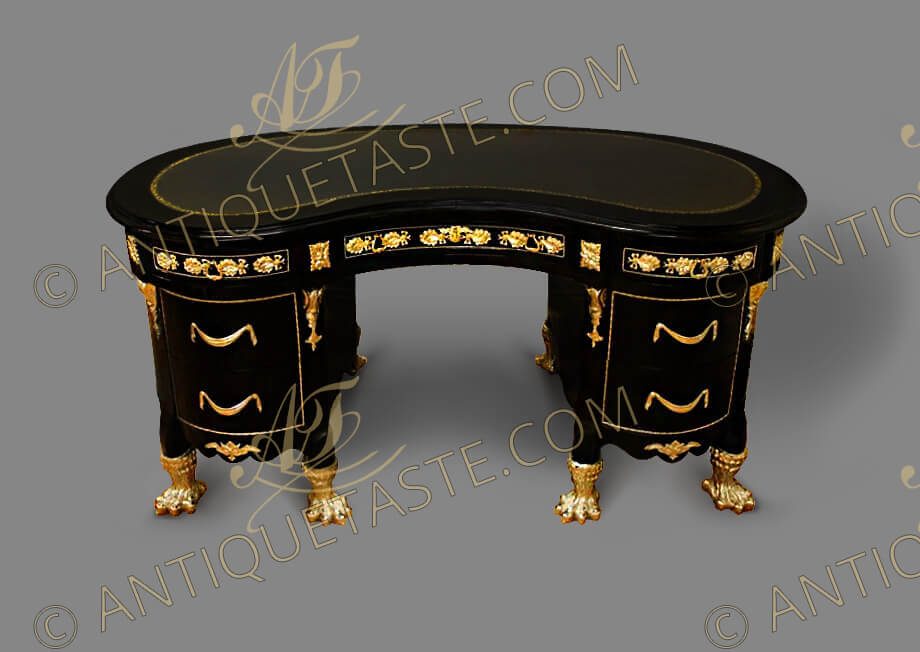 Louis XVI style kidney-shaped gilt-ormolu-mounted black colored desk on the manner of Guillaume Benneman